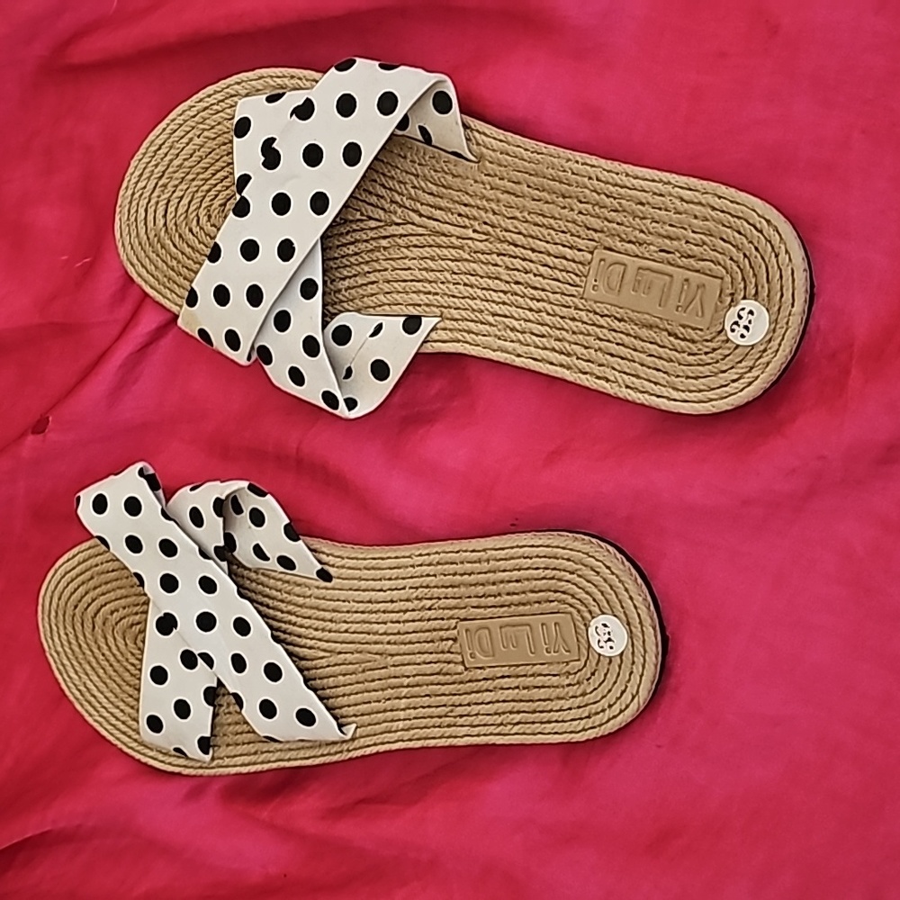 Brown new poke it up flip-flops white with black dots.